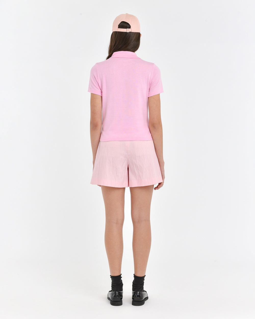 pink cotton polo shirt with jewel button