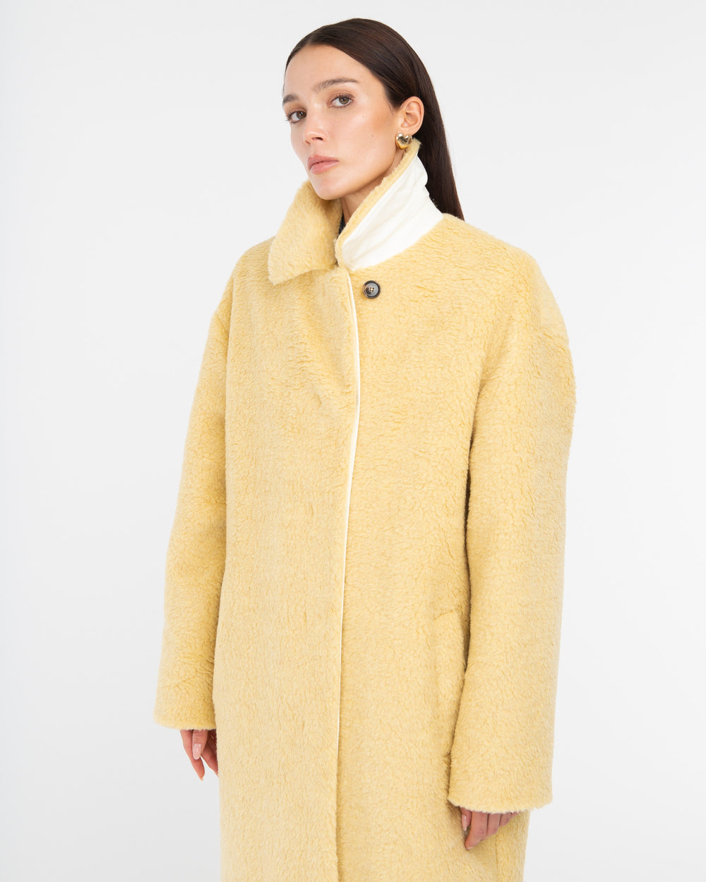 yellow teddy over coat