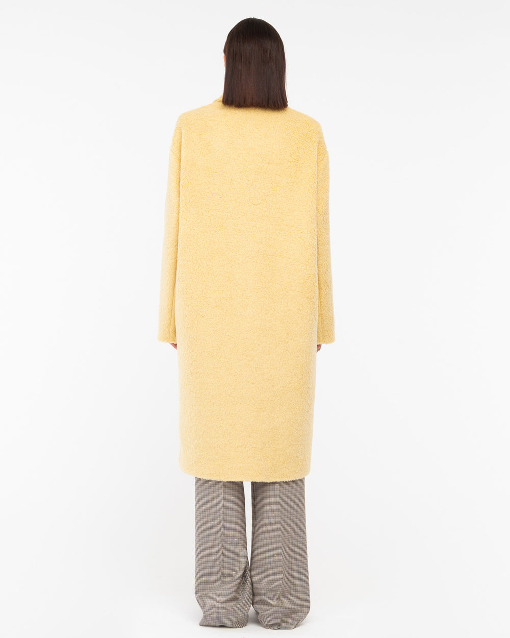 yellow teddy over coat